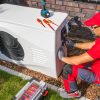 Technician Repairing Heat Pump Unit warmtepomp
